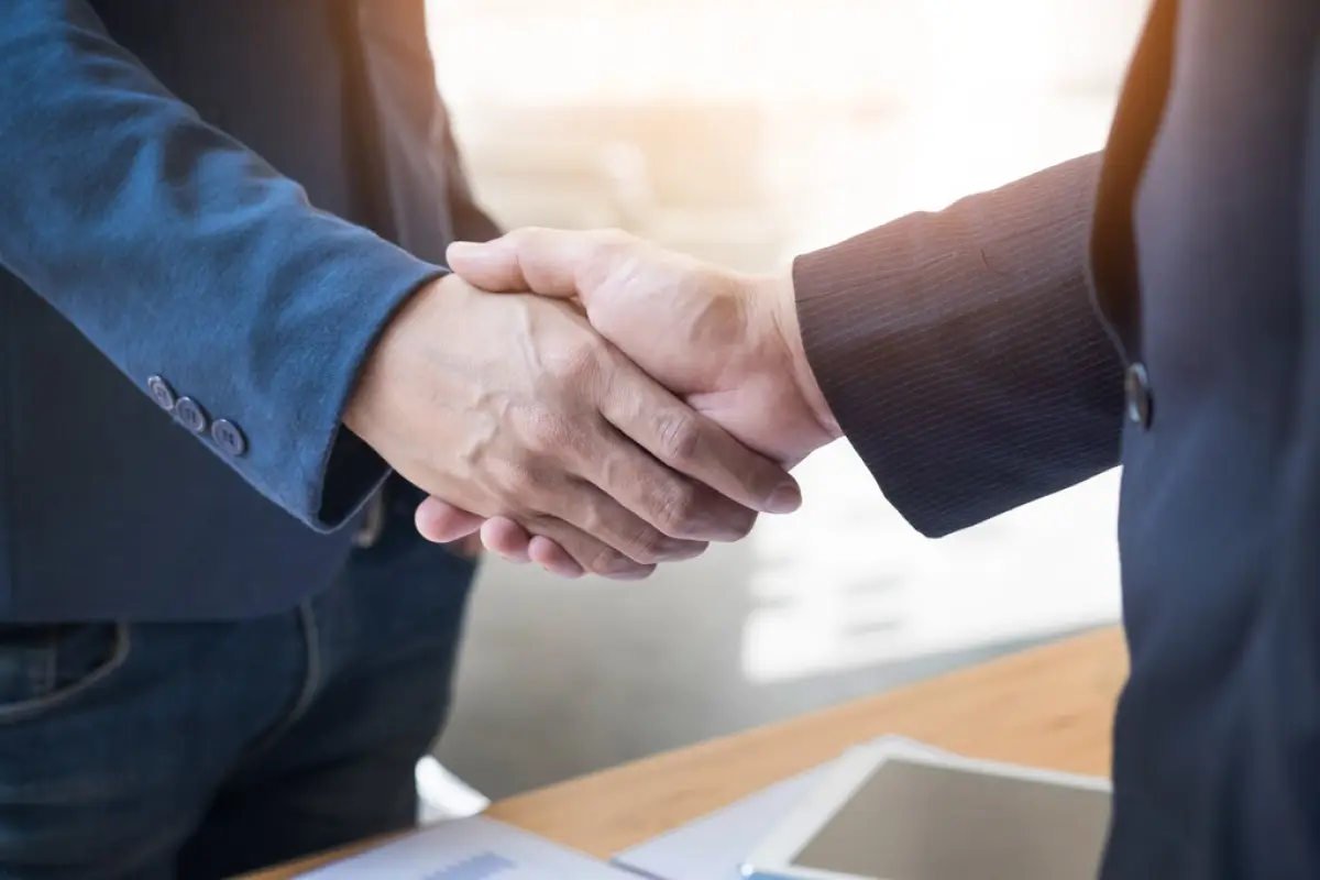 Two confident business man shaking hands during a meeting in the, Two confident business man shaking hands during a meeting in the office, success, dealing, greeting and partner concept