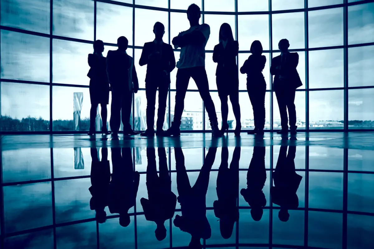 Business team, Business team standing against window with leader in front