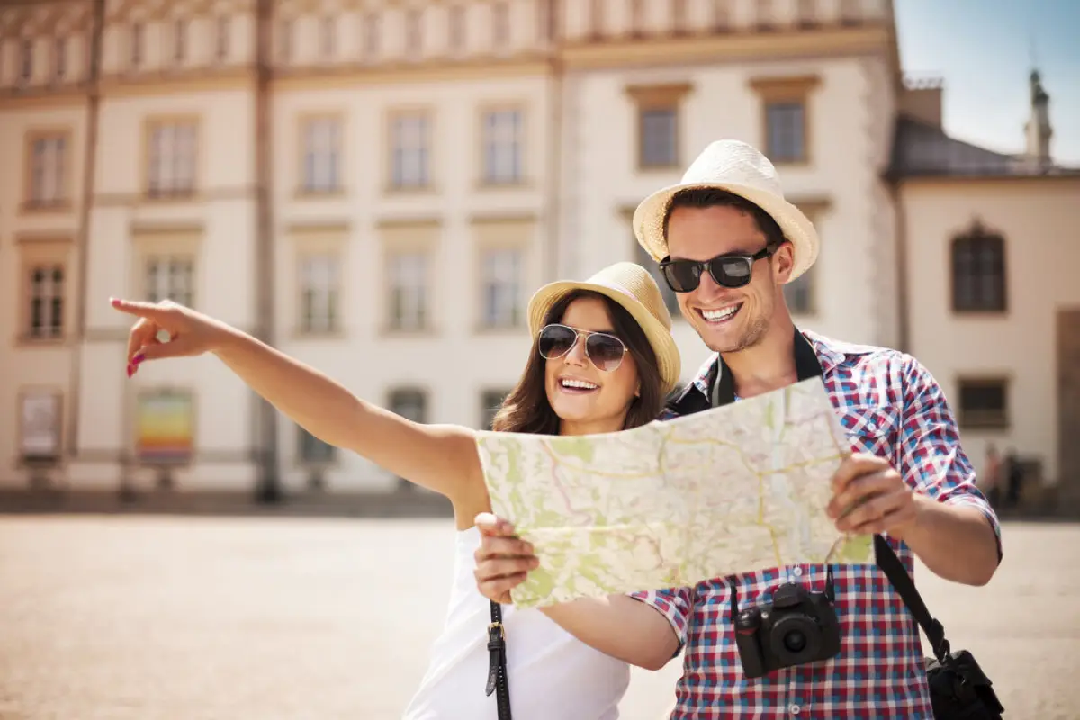 Happy tourist sightseeing city with map,  