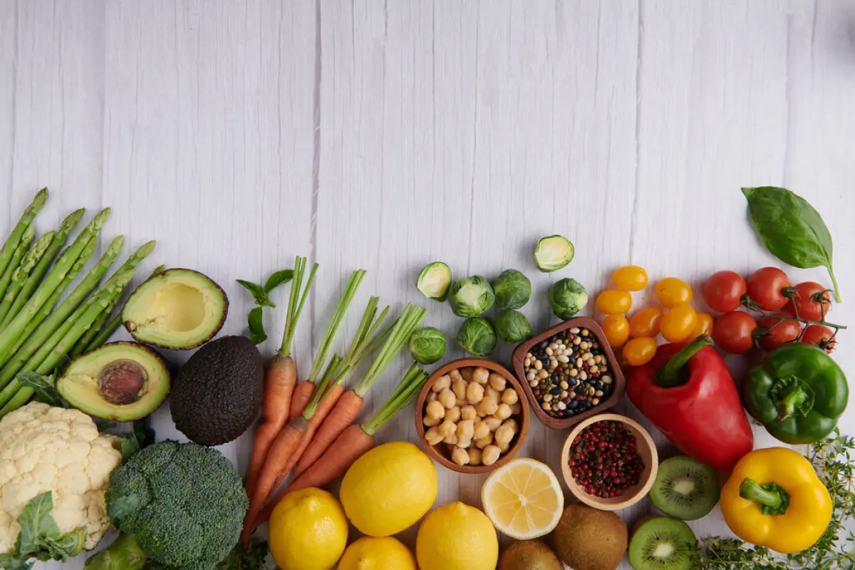 Healthy food background. Food photography different fruits and v, Healthy food background. Food photography different fruits and vegetables on white wooden table background. Copy space. Shopping food in supermarket. studio photo of different fruits and vegetables.